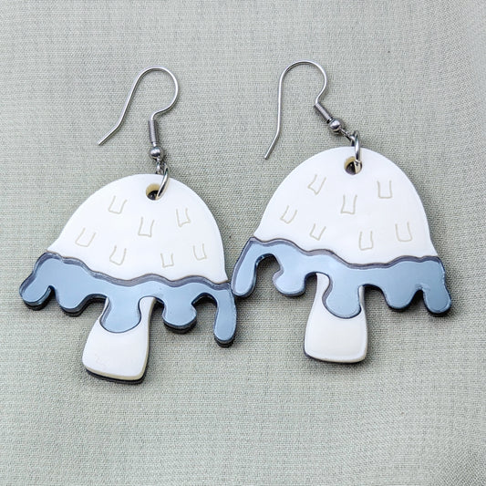 Inky cap mushroom earrings made with beige and dark gray acrylics on stainless steel fishhooks