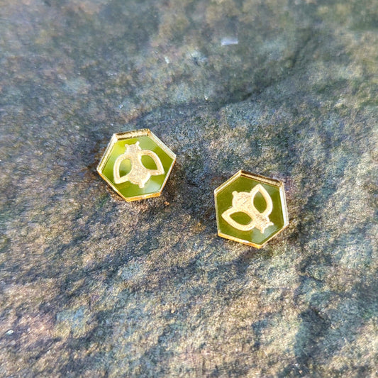 Hexagon shaped stud earrings in pale gold with engraved bees.